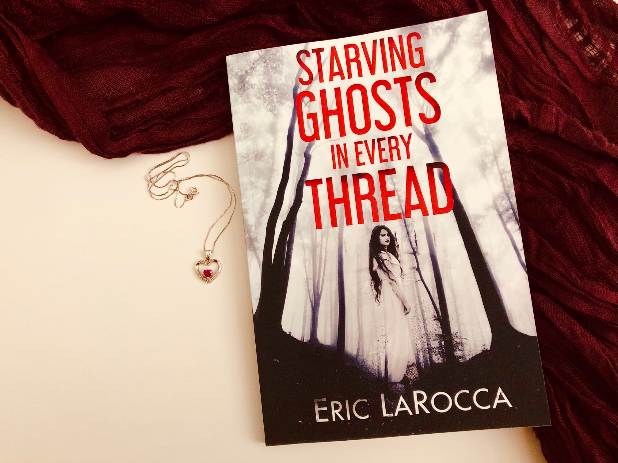 Starving Ghosts In Every Thread by Eric LaRocca book photo by Erica Robyn Reads