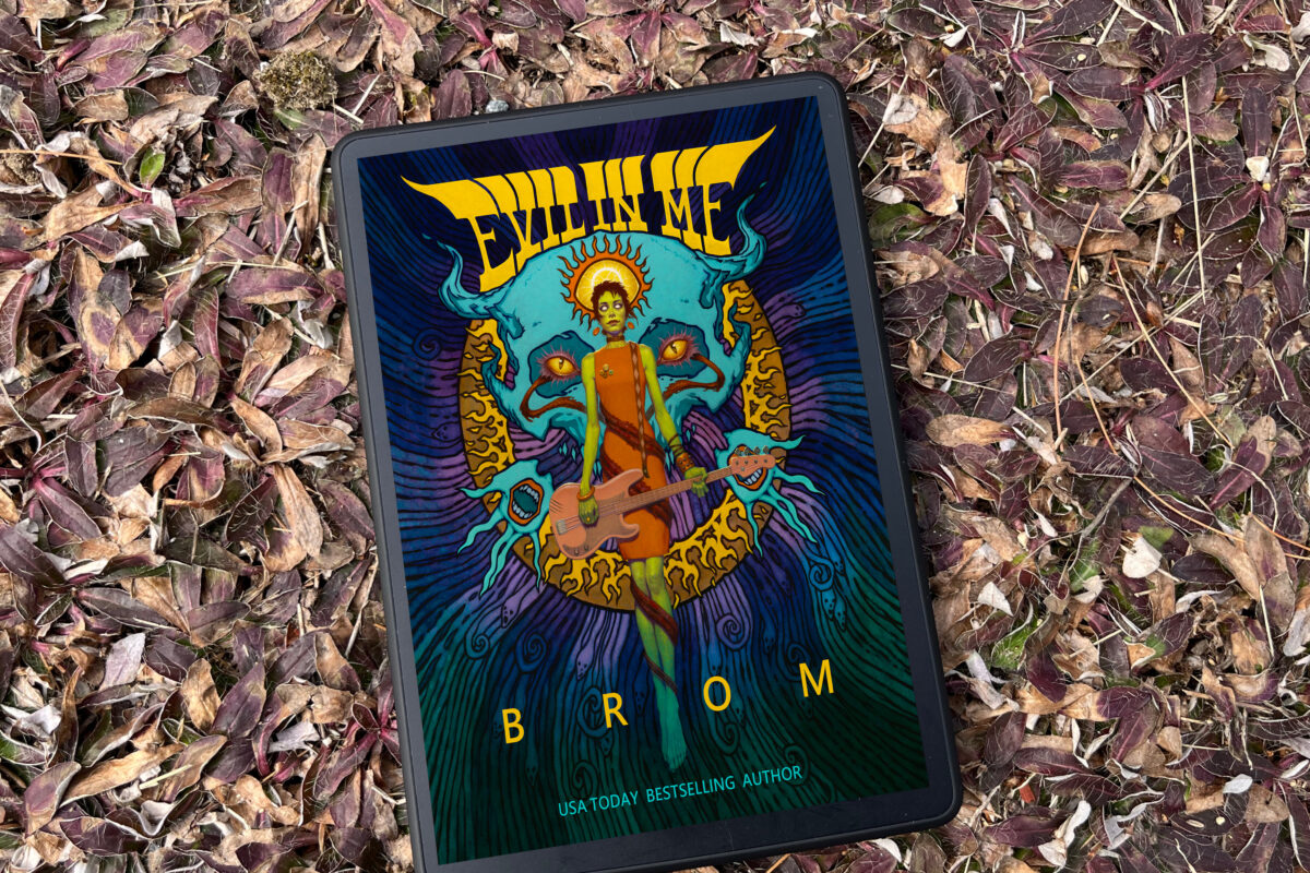 Evil In Me by Brom book photo and book review by Erica Robyn Reads - book cover features demon musical artist