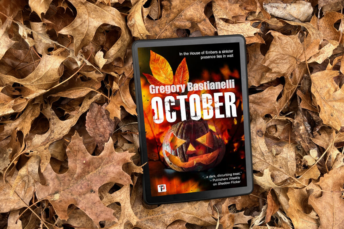 October by Gregory Bastianelli | Book Review by Erica Robyn Reads image features book cover with jack-o-lantern on fire sitting in a pile of leaves