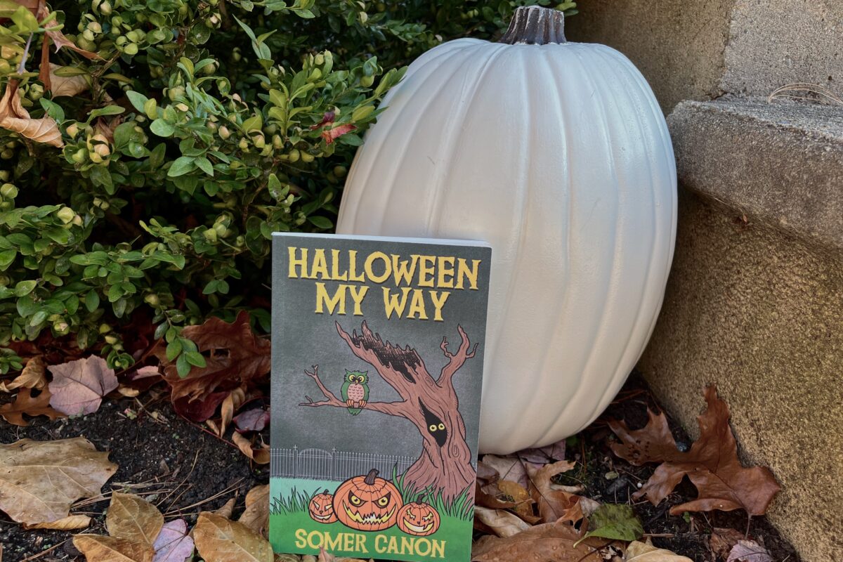 Halloween My Way by Somer Canon - photo of a white pumpkin sitting on leaves with copy of the book Halloween My Way by Somer Canon